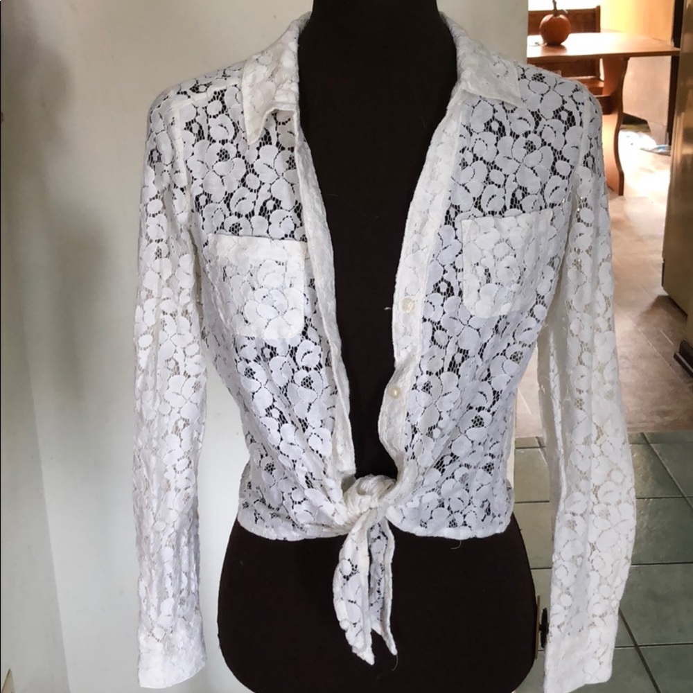 Very cute sweater. Does button up the front